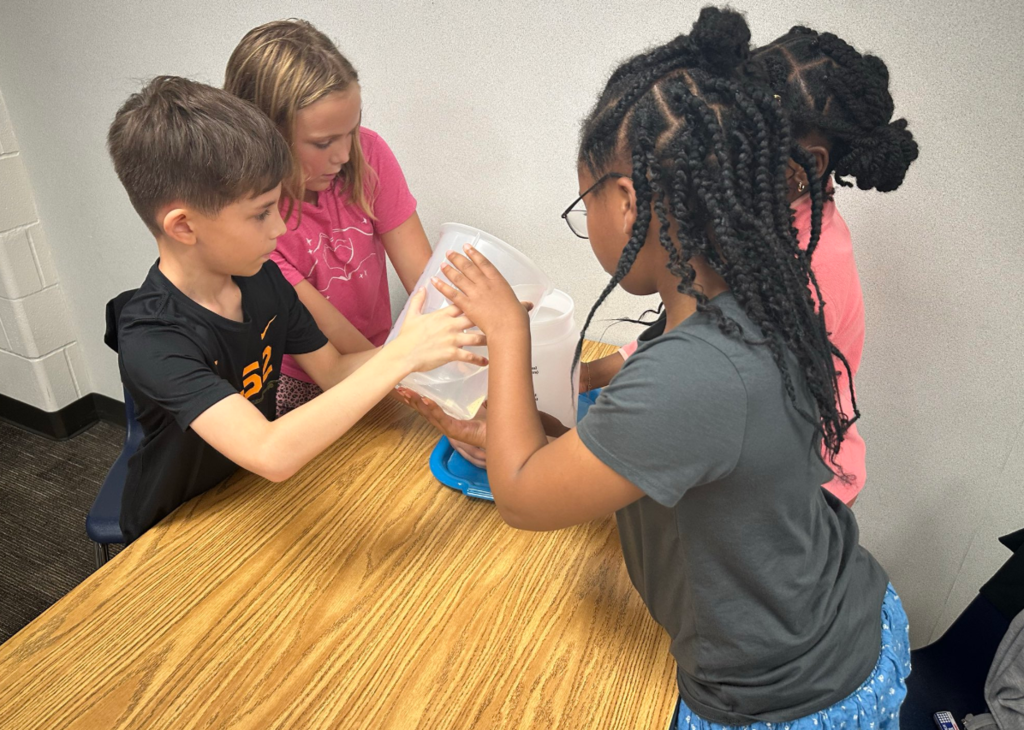 Students measuring lquid