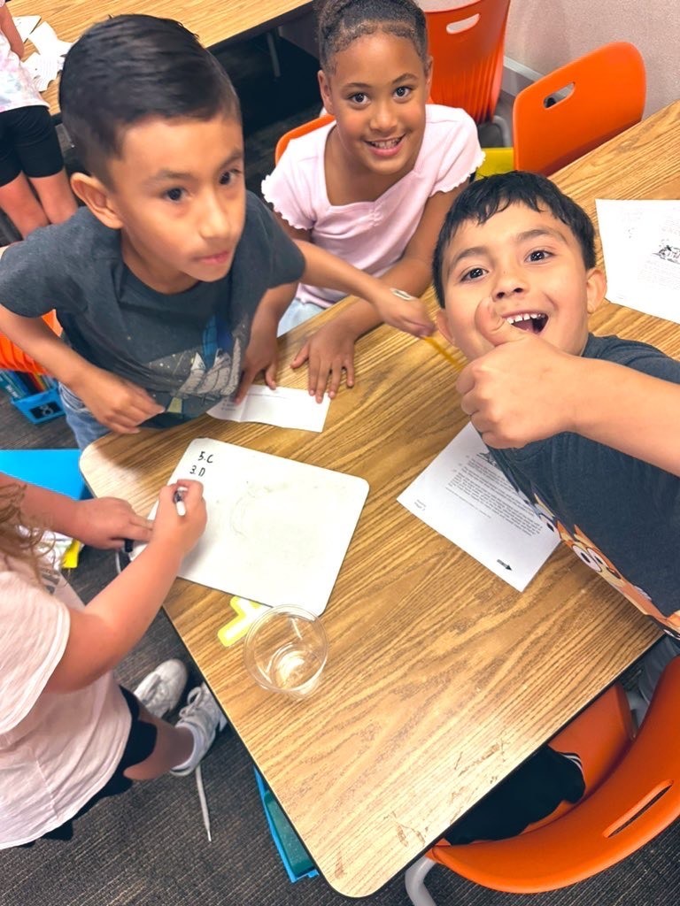 Students work with groups to practice for a reading test.
