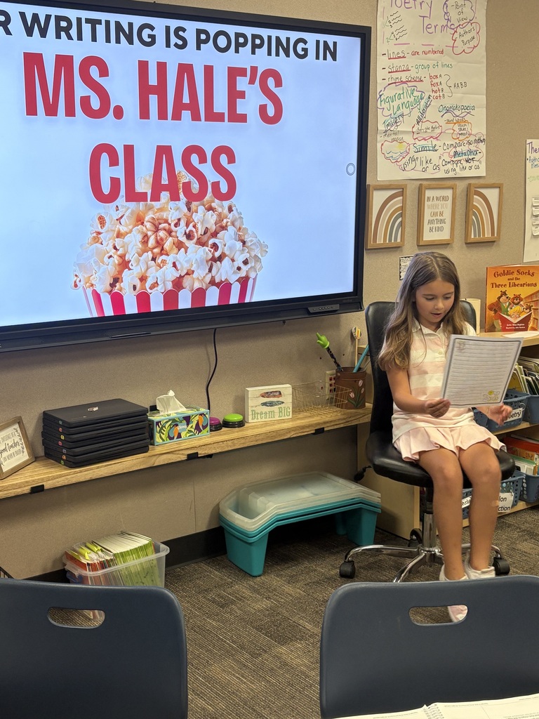 Student reading her writing to the class.