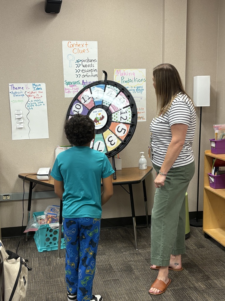 Student spinning the wheel for a class prize.
