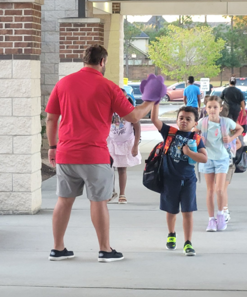 Watch DOGs greeting students