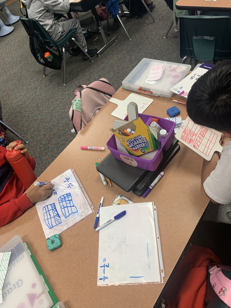 student whiteboards showing rectangular fraction models