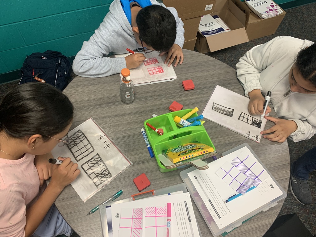 student whiteboards showing rectangular fraction models