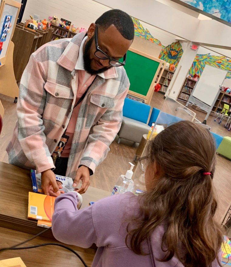 Librarian for a Day helping staff