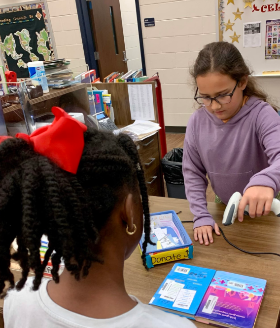 Librarian for a Day helping students
