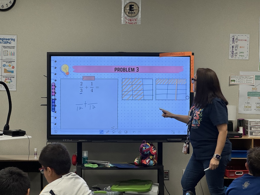 Teacher modeling how to add fractions with unlike denominators using pictorial representations.