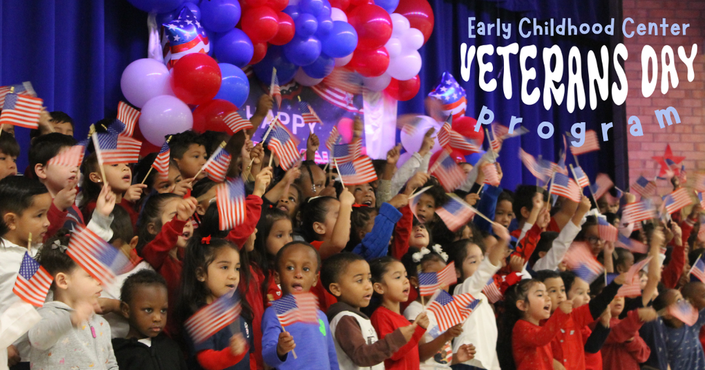 ECC students wave flags as they perform at the ECC Veterans Day Program.