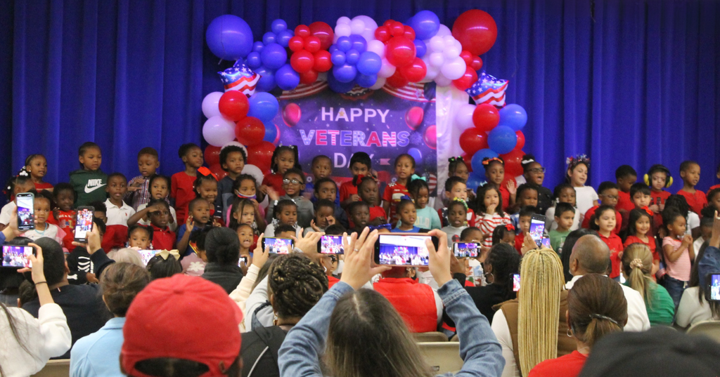 Parents watch as ECC students perform at the Veterans Day Program.