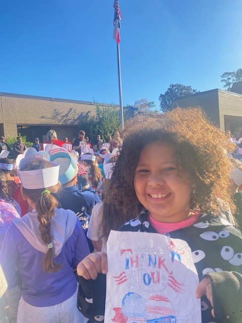 Student at Veteran's Day service.