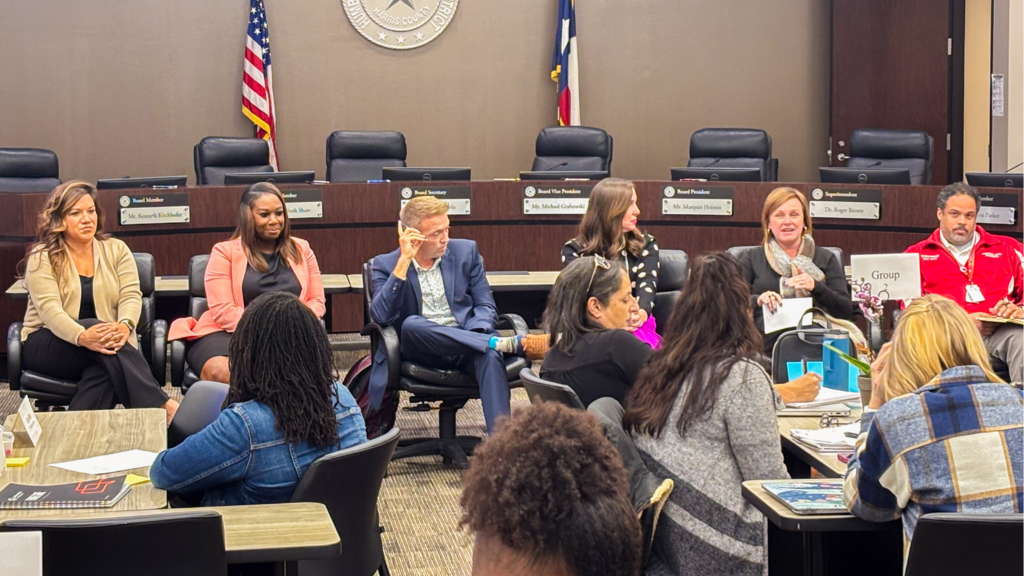 admin sitting in a row discussing