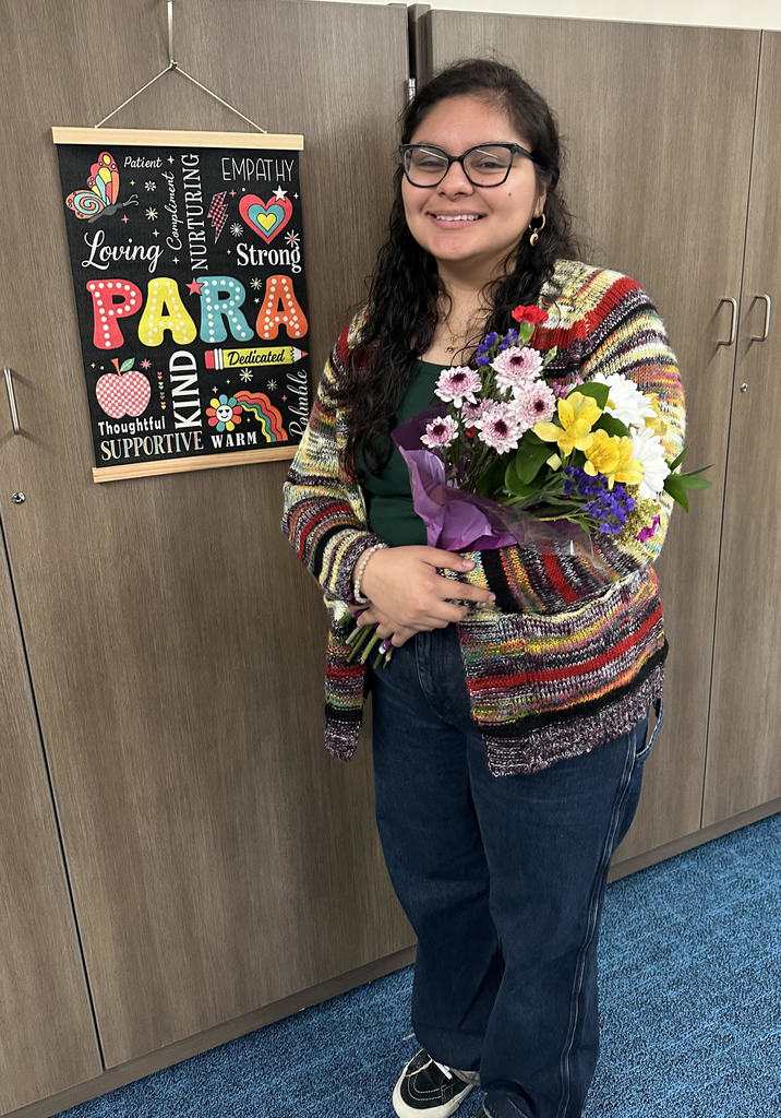 Miss Frida Estrada with flowers.