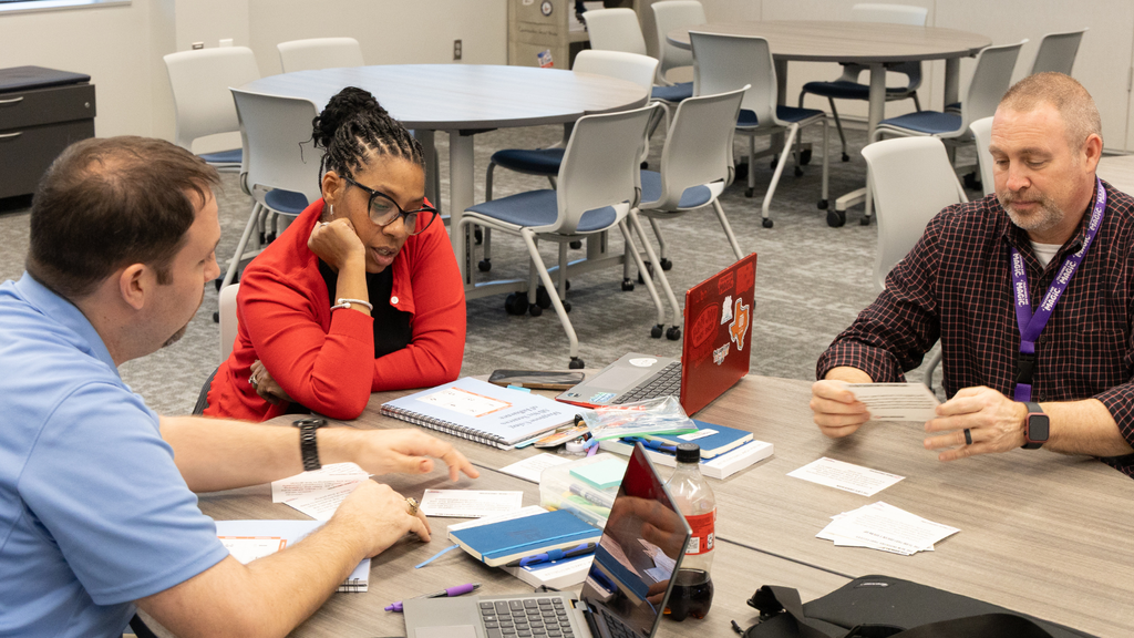 Teachers talking about ways to handle difficult conversations in a group