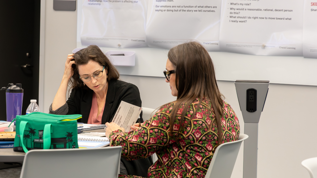 Teachers talking about ways to handle difficult conversations in a group