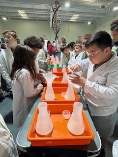 3rd grade students performing science labs.