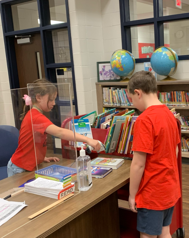 Librarian for a Day reading to students