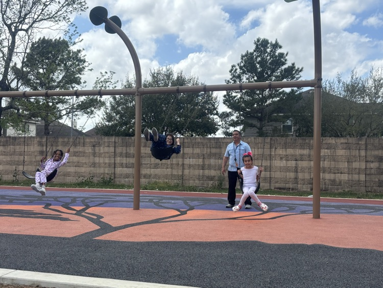 Mr. Carlos on the swings 