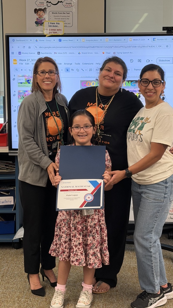 Violet being recognized as a top district mathematician with her principal, assistant principal and teacher.