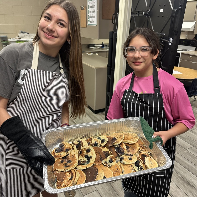 CMS students cooking pancakes