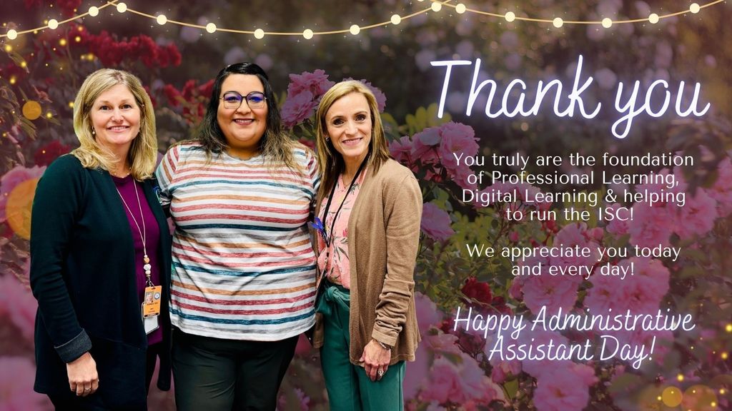 3 women smiling together in front of a floral garden