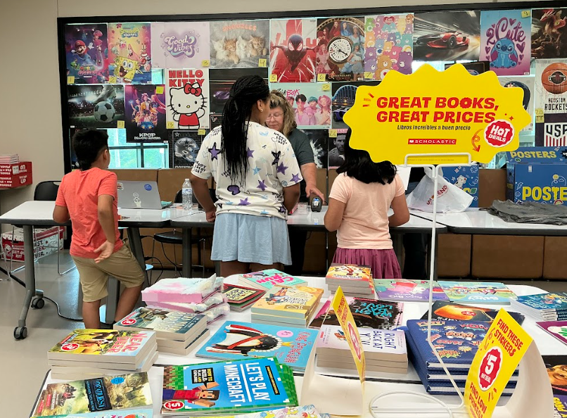 Ms. Craig and students checking out at the Spring Book Fair!