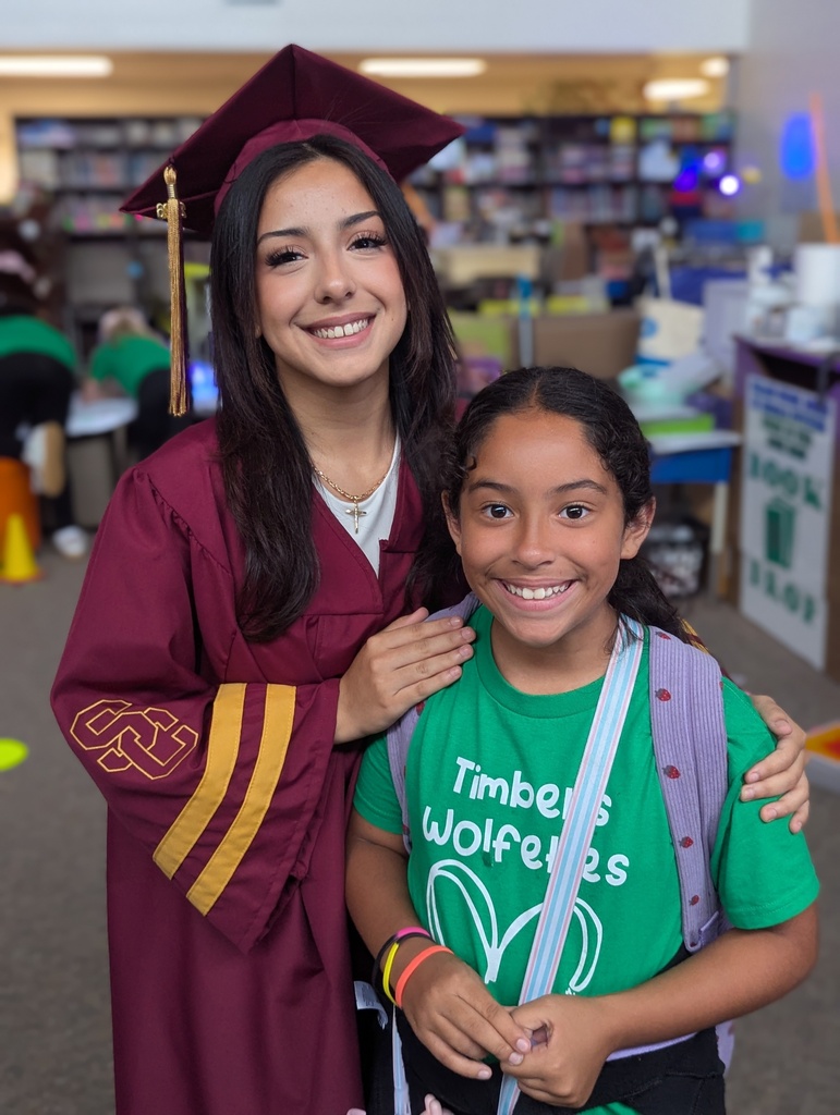 A graduating senior with her cousin