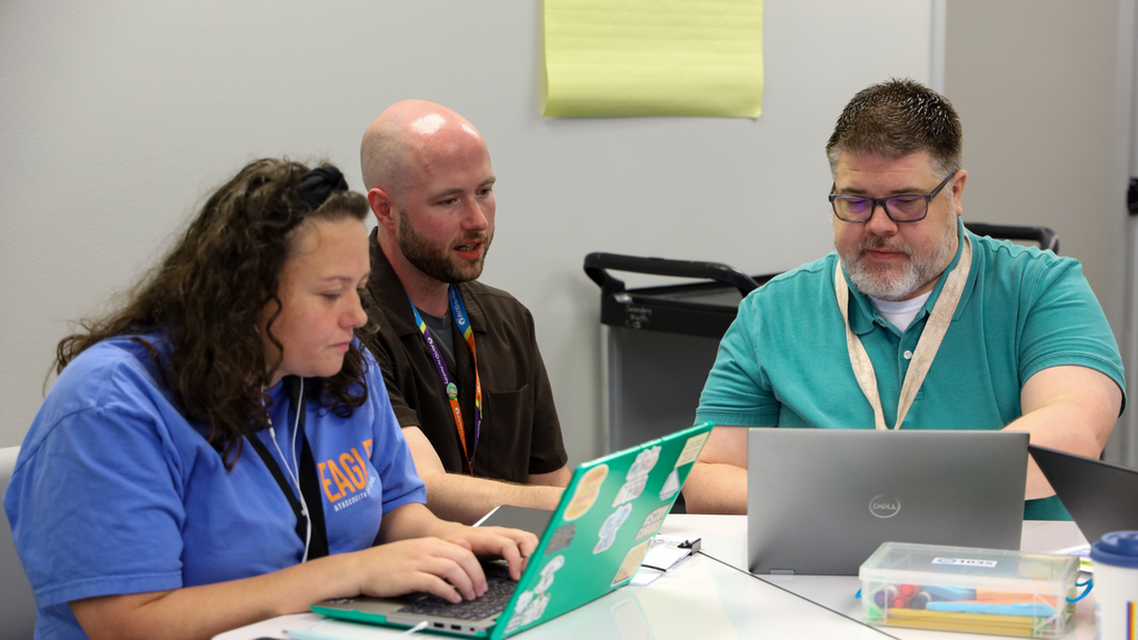 people collaborating around computers