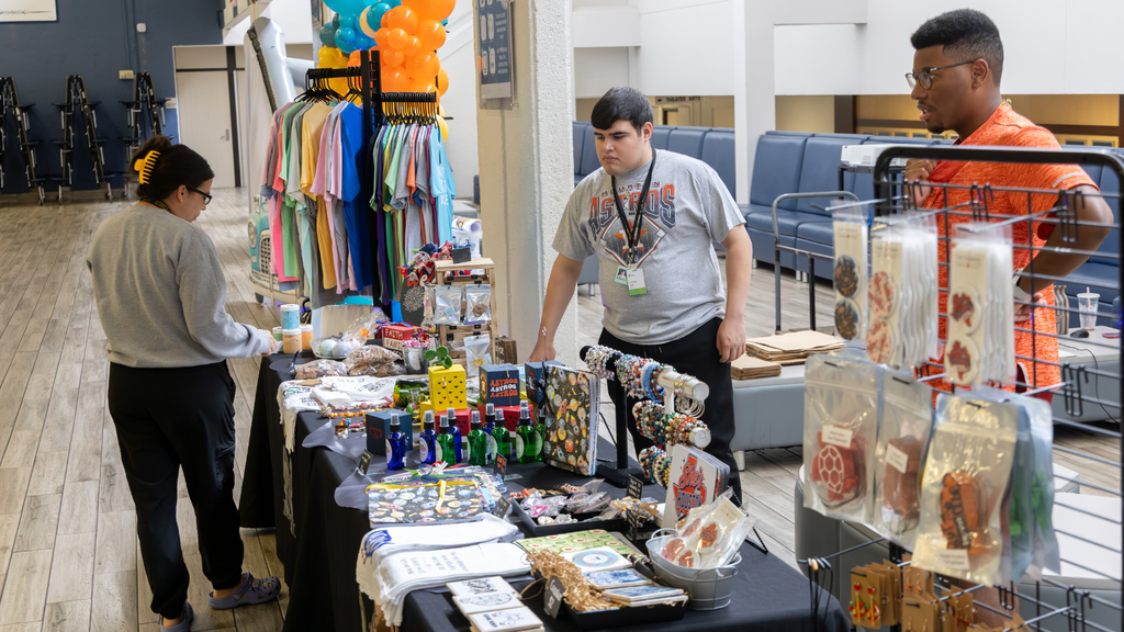 students selling merchandise