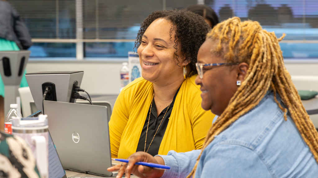 woman smiling on laptop