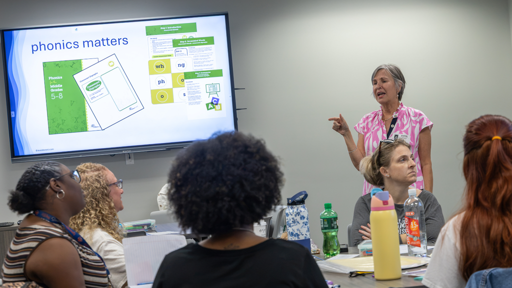 presenter talking to a group of educators