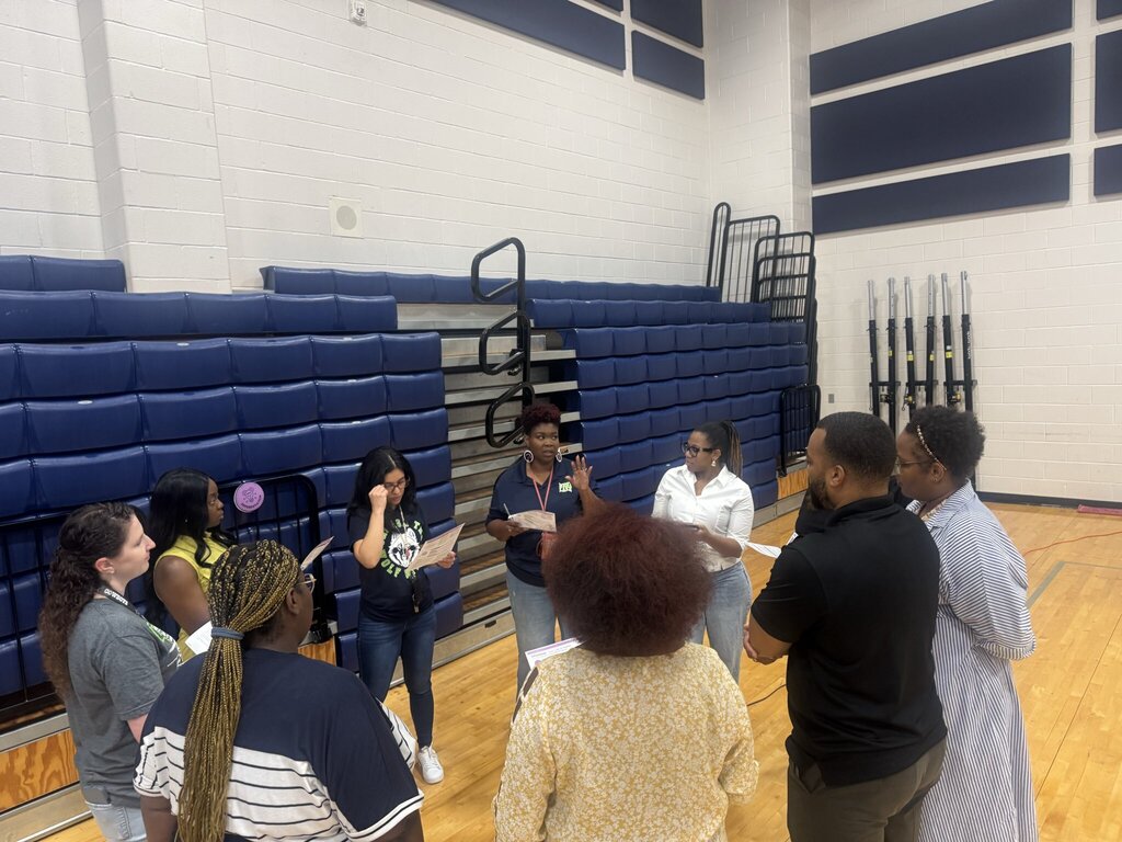 teachers standing in the gym at a PD