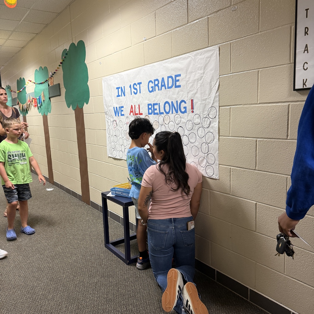 Staff welcoming families back to HHE