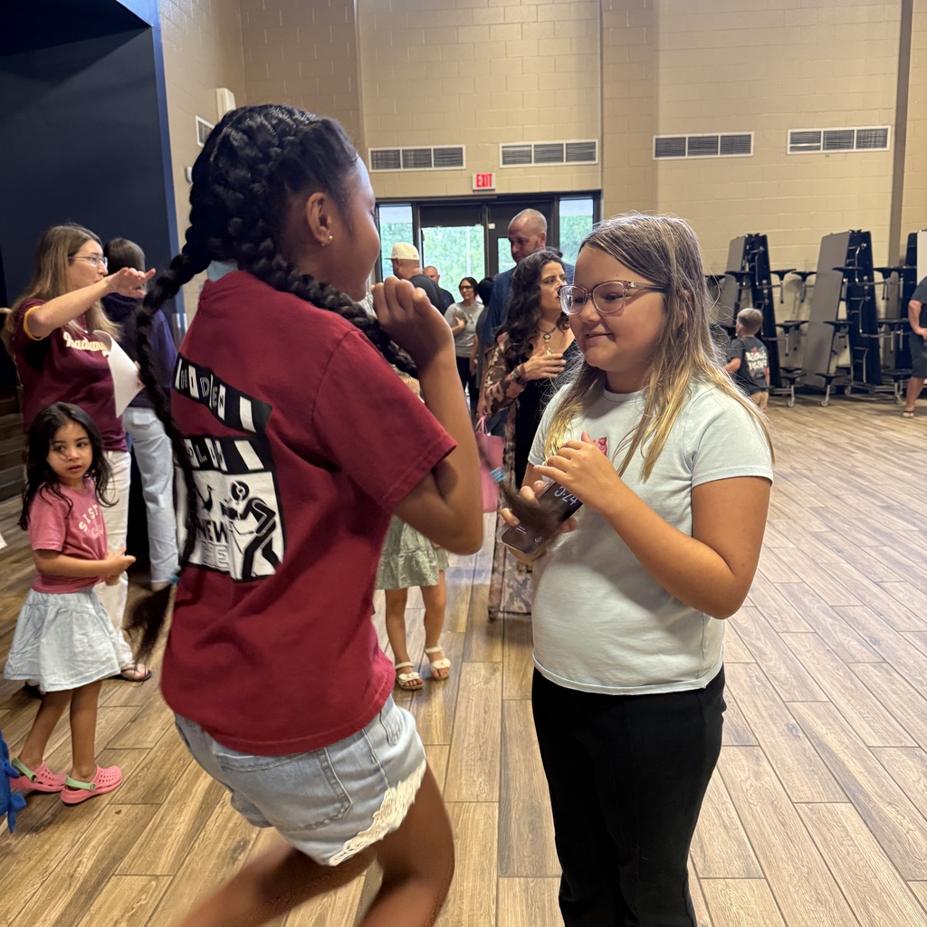 Staff welcoming families back to HHE