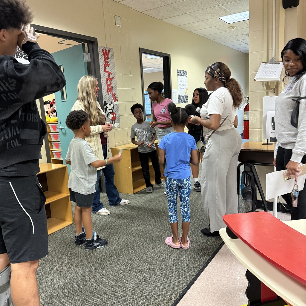 Staff welcoming families back to HHE