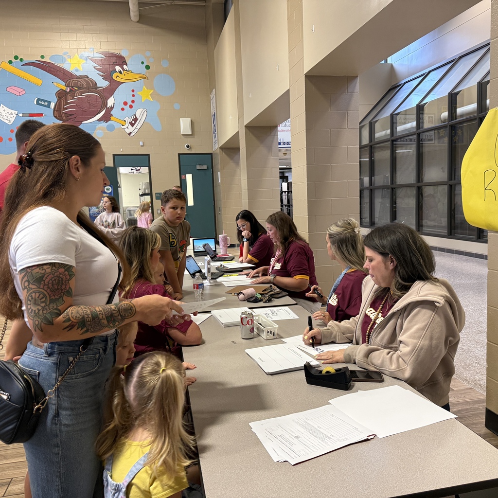 Staff welcoming families back to HHE