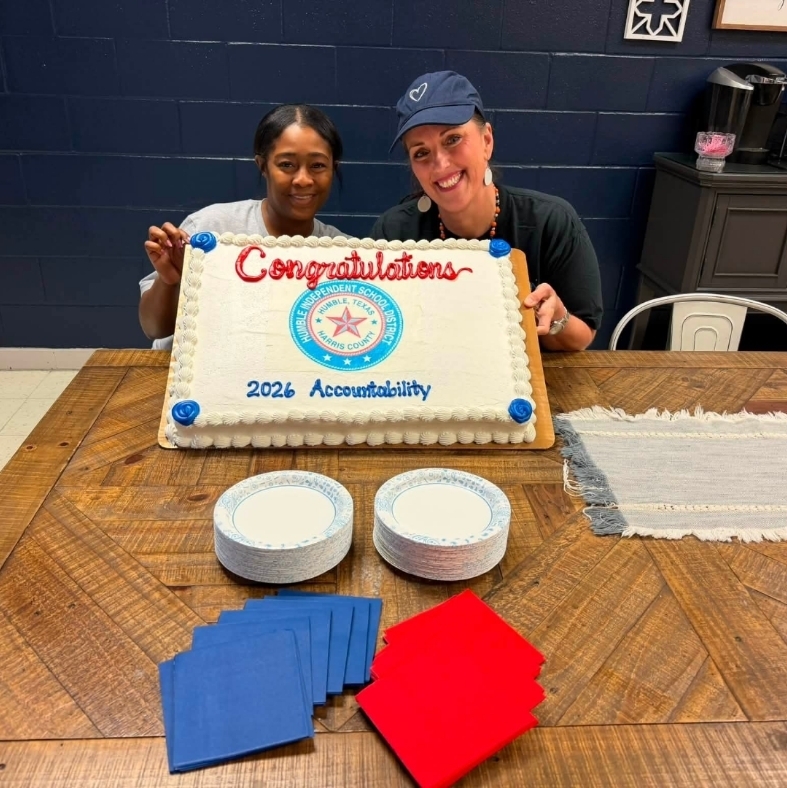 Ms. Collins and Ms. Allen with the celebration cake