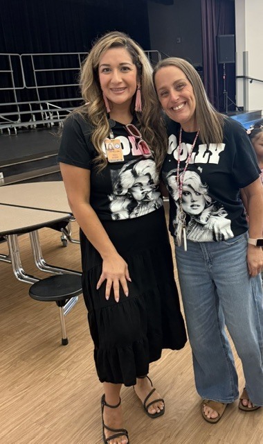 Two teachers wearing Dolly Parton shirts