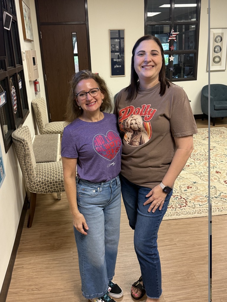 Two teachers wearing Dolly Parton shirts