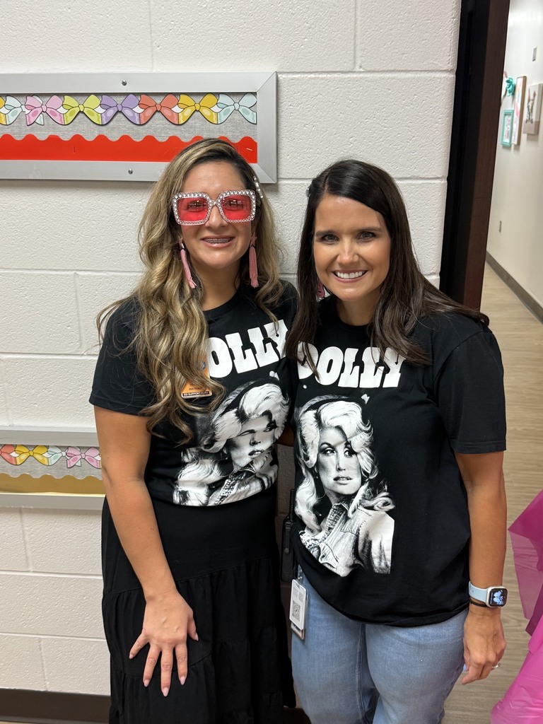 Two teachers wearing Dolly Parton shirts