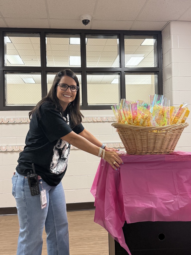 school counselor is pushing cart of snacks