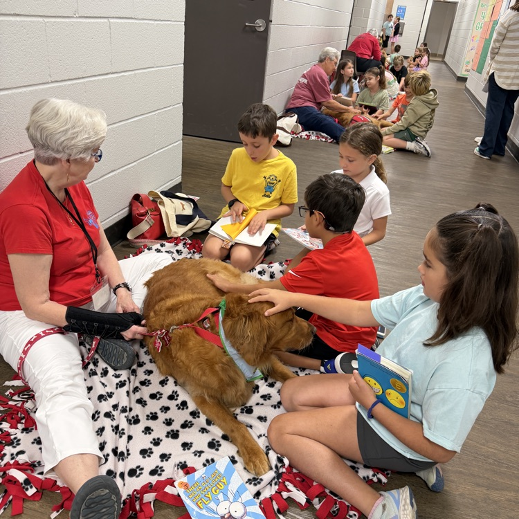 kids reading to paws for reading dogs