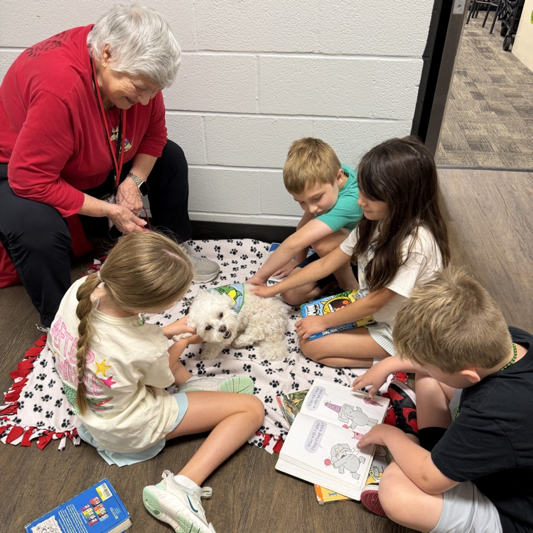 kids reading to paws for reading dogs