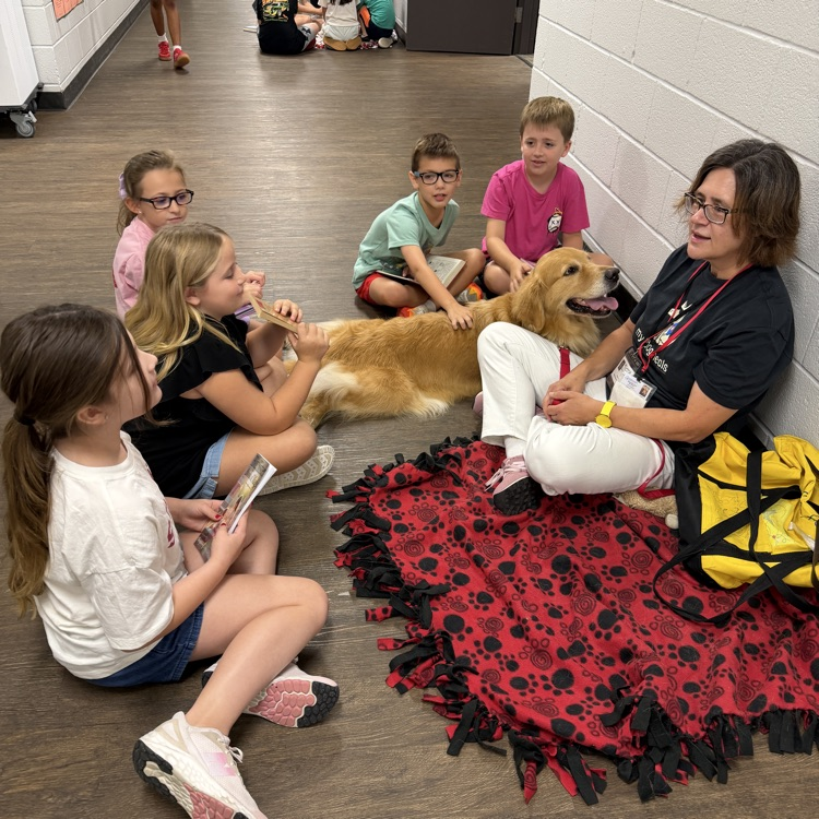 kids reading to paws for reading dogs