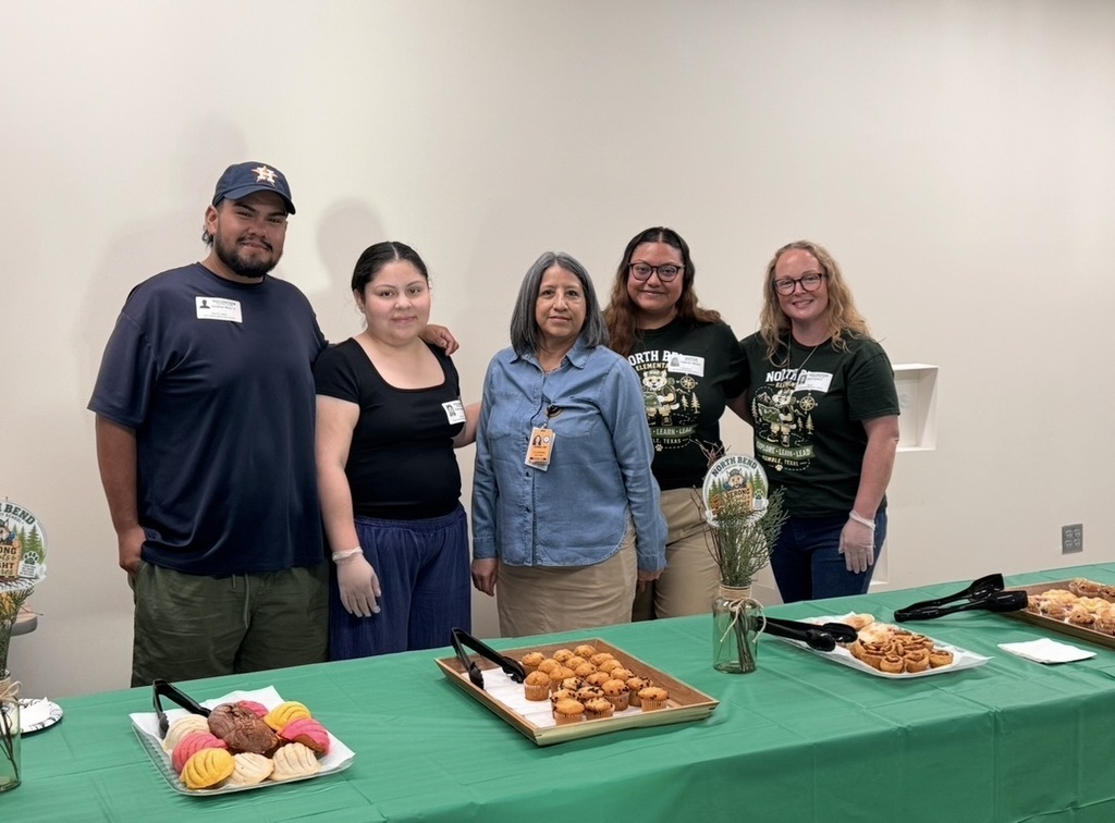 Parent volunteers, Ms. Delavina and PTO President and VP helping with the pastries.