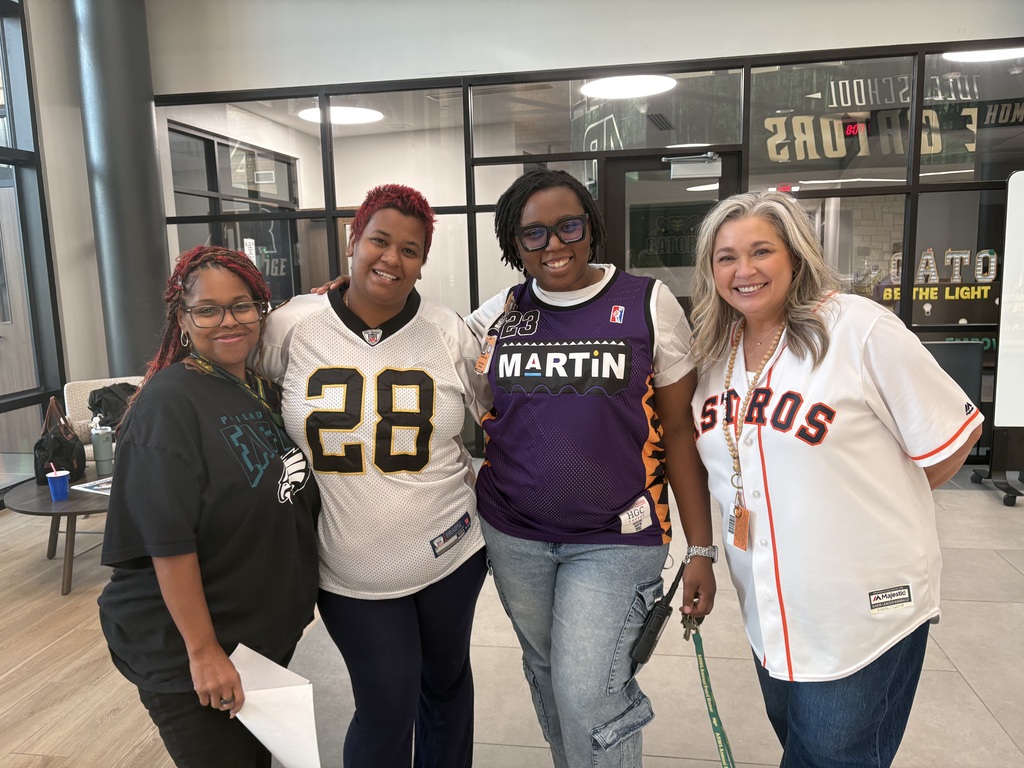 4 staff members dressed up in their jerseys for GFW