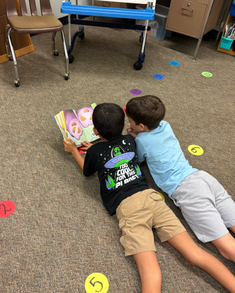 Students reading a book together