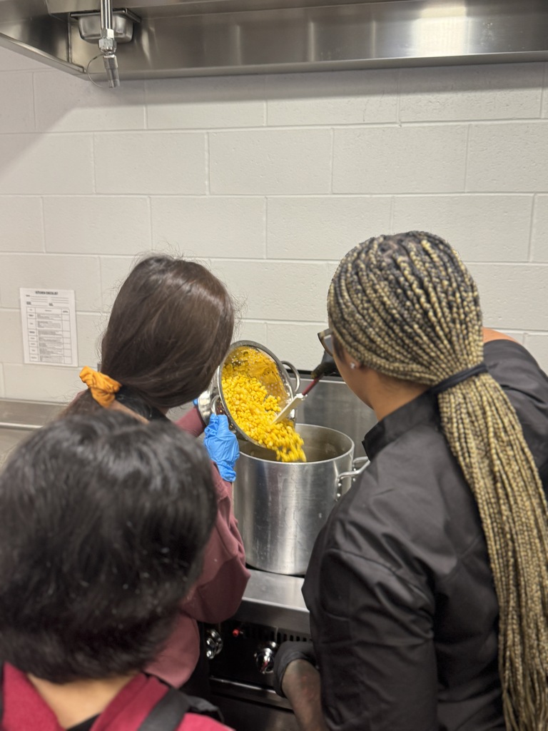 chef helping make corn