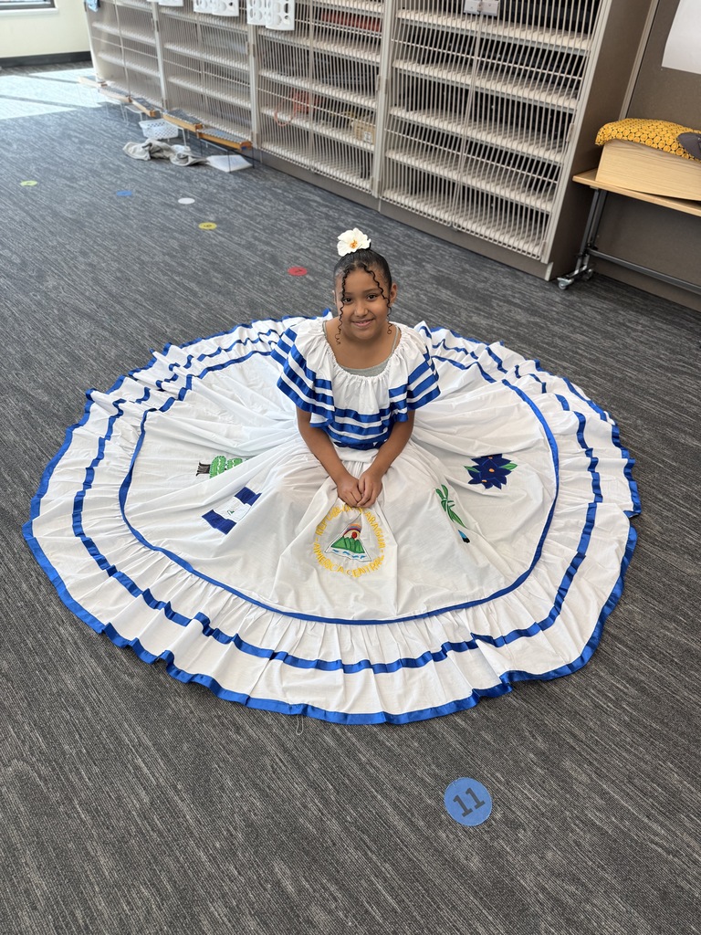 Student showing her beautiful dress from El Salvador.