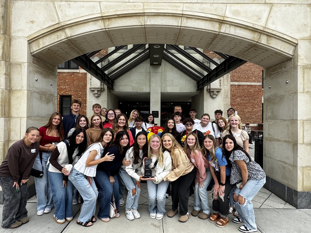 Students pose with trophy
