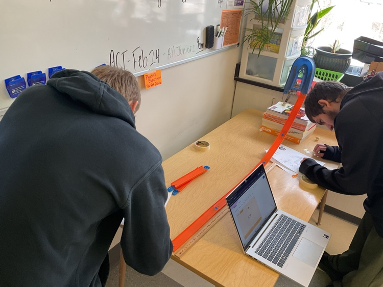 Students determining the speed of the marble  