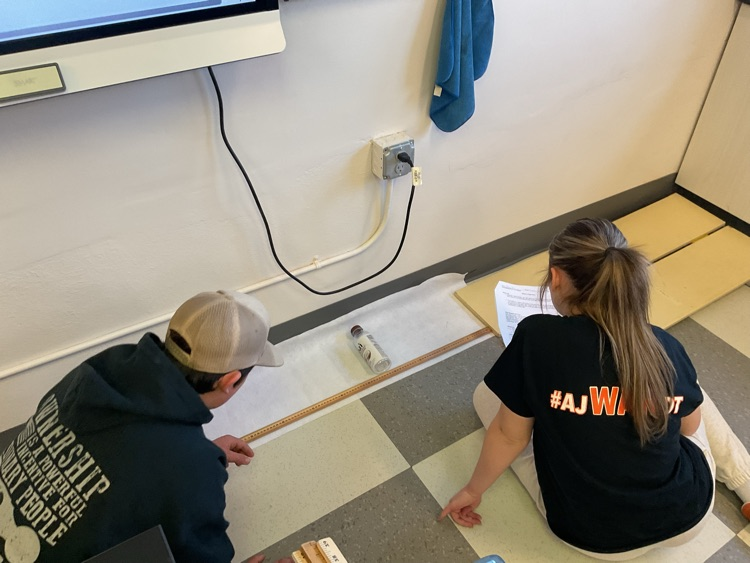 students compare acceleration down ramps